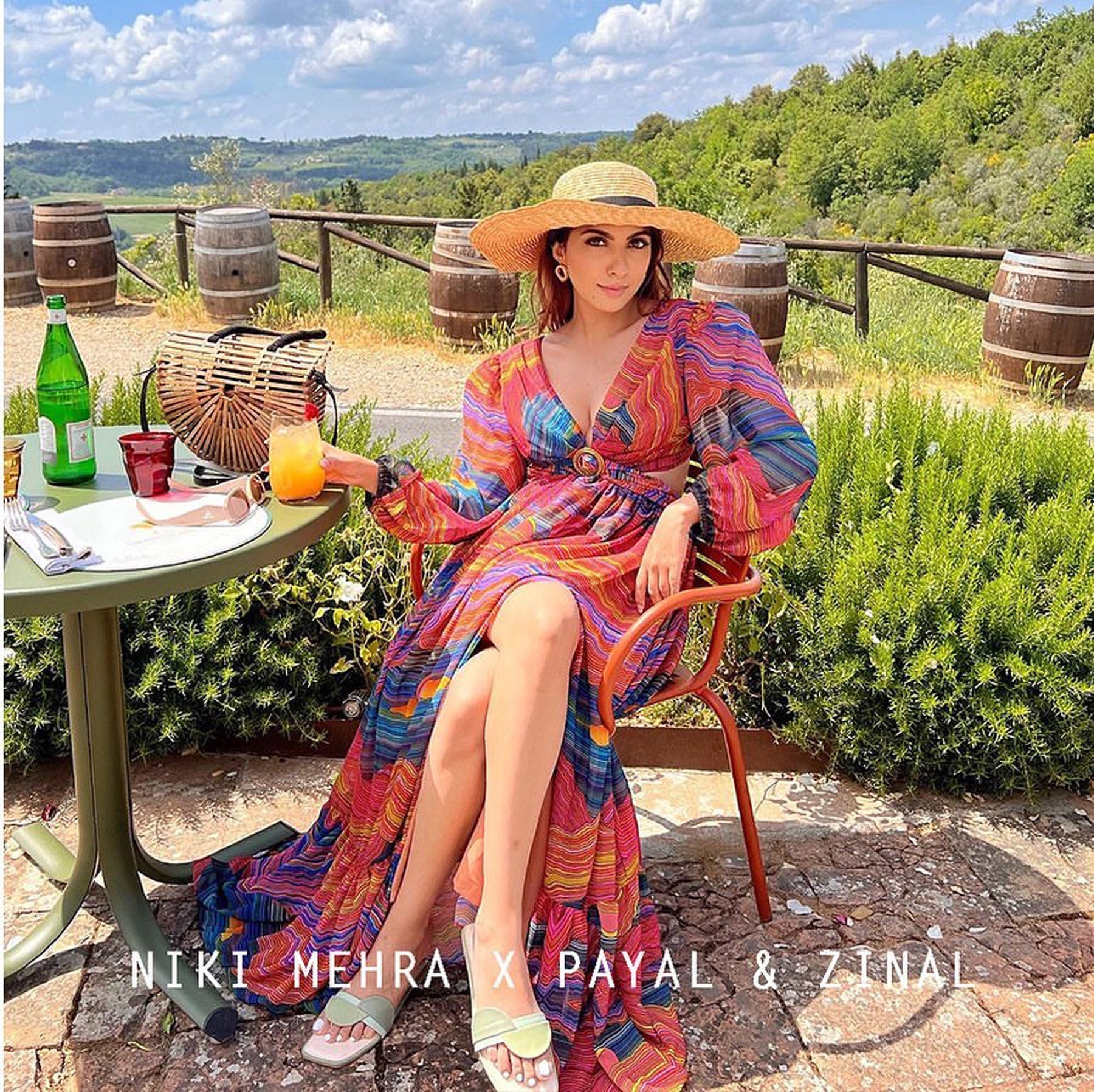 Niki Mehra In Mountain print slit dress
